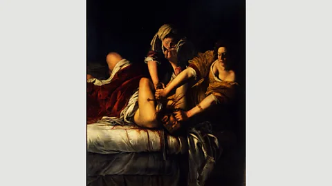 Getty Judith and Holofernes, c 1621, is held in the Uffizi Gallery, Florence – a number of her works have been read as revenge in oil paint (Credit: Getty)