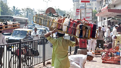 Paul Quayle/Alamy India’s can-do approach is personified by Mumbai’s dabbawallahs, who deliver hot lunches to 200,000 office workers each day (Credit: Paul Quayle/Alamy)