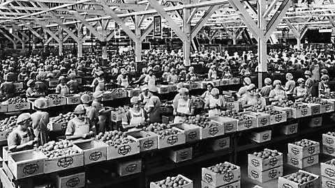 Getty Images Factory and production workers have less freedom to manage their own time, freeing them from the stress of juggling schedules, Aeon says (Credit: Getty Images)