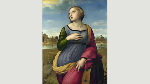 Wikimedia Raphael’s portrait of Catherine of Alexandria shows the Christian martyr leaning on a torture device known as an ‘execution wheel’ (Credit: Wikimedia)