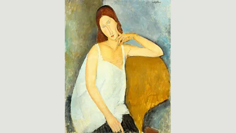 Wikimedia Modigliani created this portrait of his lover and muse Jeanne Hébuterne a few months before he died (Credit: Wikimedia)