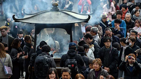 Getty Images Tourists flock around Tokyo's Senso-ji temple. Driven by China, Japan's tourism numbers have grown by double digits every year for the last six years (Credit: Getty Images)