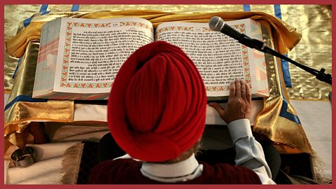 Image - reading the Guru Granth Sahib in the Gudwara 