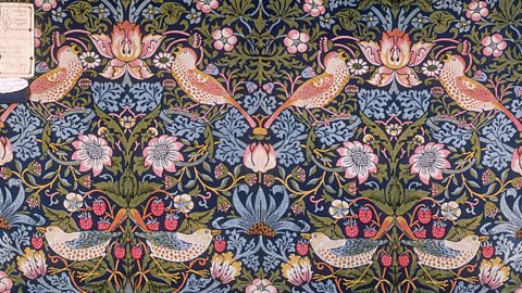 A pink and blue floral wallpaper design with birds.