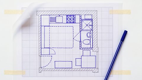 Floor plan grid drawn out with blue pen over tracing paper.