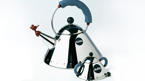 A large and small kettle made with a reflective material placed side by side.