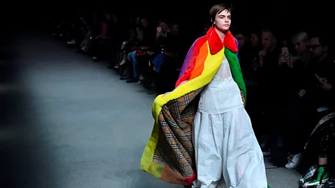 Getty Images Burberry’s faux-fur rainbow cape modelled by Cara Delevingne was the stand-out piece at the autumn/winter shows in London (Credit: Getty Images)