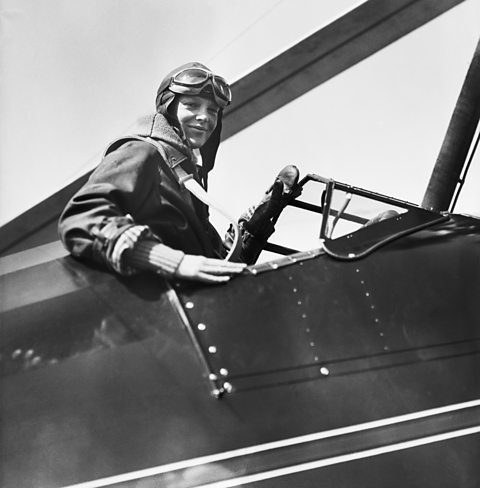 Amelia Earhart in the cockpit of her plane.