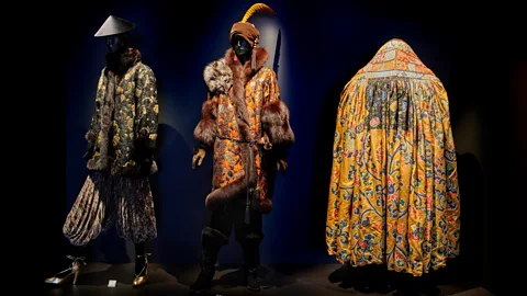 Musée Yves Saint Laurent Paris / Sophie Carre The silhouettes of the Saint Laurent designs echo traditional Asian styles (Credit: Musée Yves Saint Laurent Paris / Sophie Carre)