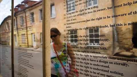 Christian Harberts/Alamy Translations of Užupis’ constitution are engraved on mirrored s that line the Avenue of Constitutions (Credit: Christian Harberts/Alamy)