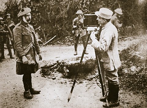 A French cameraman films a wounded Scottish soldier at the Battle of the Somme in 1916