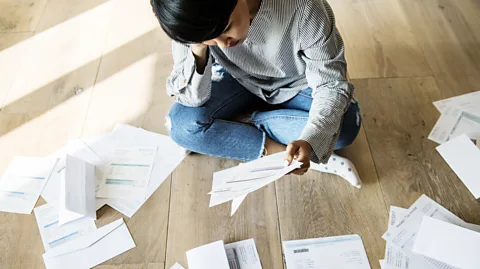 Getty Images Younger workers in most countries are shouldering bigger student debts than previous generations (Credit: Getty Images)