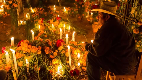 Nacho Calonge/Alamy As well as creating alters with offerings to the deceased, many Mexicans decorate the graves of loved ones in anticipation for their spirits’ return (Credit: Nacho Calonge/Alamy)