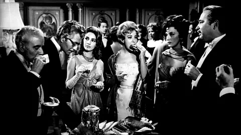 Alamy In The Exterminating Angel, a group of wealthy dinner guests inexplicably find themselves unable to leave their host’s living room (Credit: Alamy)