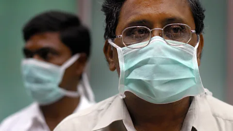 Alamy Men wearing face masks (Credit: Alamy)