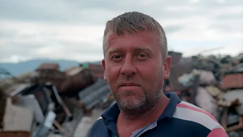 Stephen Dowling Adi, who owns a scrapyard in Gjirokaster, breaks up the dissued bunkers (Credit: Stephen Dowling)
