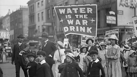 A march for prohibition with men, women and children during World War One