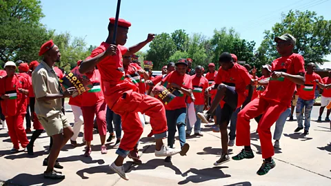 AFP Contributor/Getty Images The toyi-toyi is believed to have been invented by Rhodesian freedom fighters in modern-day Zimbabwe (Credit: AFP Contributor/Getty Images)