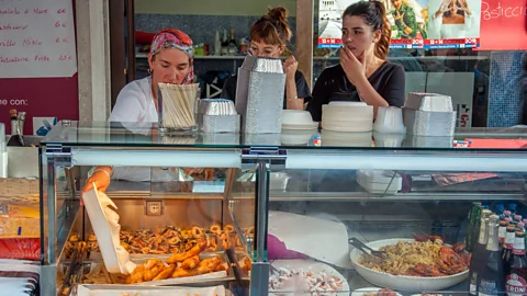 Rossi Thomson During the festival, gelato shops advertise ‘ice cream’ and vendors dish up fish and chips (Credit: Rossi Thomson)