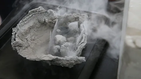 Getty Images Flammable ice appears to smoke as it melts (Credit: Getty Images)