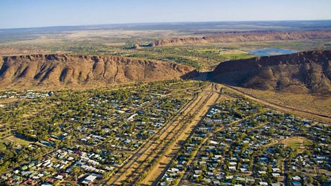 a long, straight road through Alice Springs