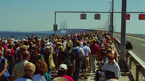 Getty Images People crossing the Oresund Fixed Link Bridge at the opening in 2000 (Credit: Getty Images)