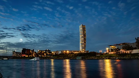 Alamy The Turning Torso tower is a 54-floor residential block that over looks the bridge it was built to symbolise Malmo's new thriving economy (Credit: Alamy)