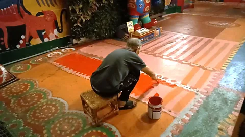 Eliot Stein In Rainbow Village, painted animals leap from the walls and peek out from doorways (Credit: Eliot Stein)