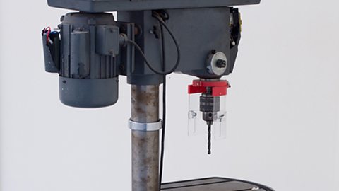 A pillar drill with a rack and pinion arrangement that moves the table bed up and down.