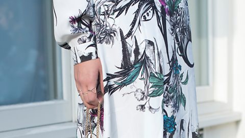 A vibrant, floral dress design from Matthew Williamson, worn by a female model.
