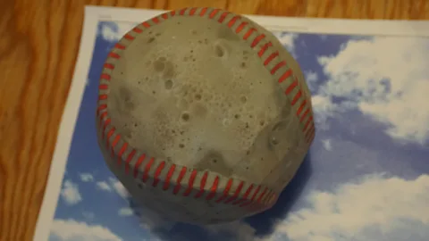 MIT By subtly changing the texture of an object, researchers were able to make a 3D printed baseball look like an espresso (Credit: MIT)