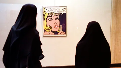 Getty Images Female visitors view The Melody Haunts My Reverie by American Pop Artist Roy Lichtenstein, on display at the TMOCA in 1999 (Credit: Getty Images)