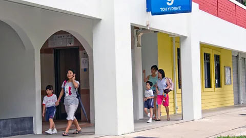 Alamy "I don’t lock my door, I make it a point to know my neighbours,” says Safura Ashari, an estate agent who helps clients find HDB units (Credit: Alamy)