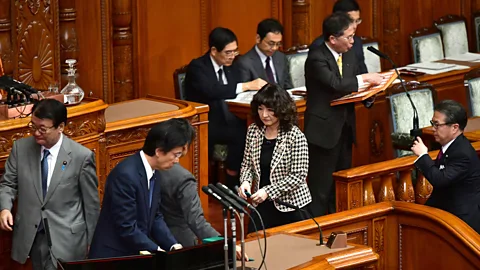 Getty Images A scene from Tokyo's parliament on 7 December 2018, when it passed an historic bill to bring in more foreign, blue-collar workers than ever (Credit: Getty Images)