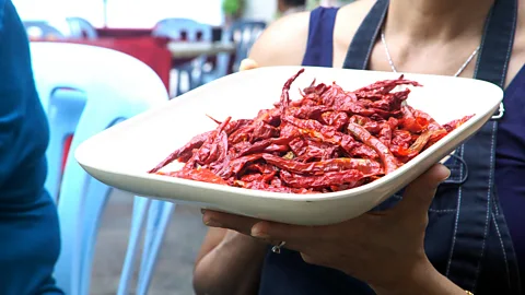 Tim McDonald The homemade version of debal curry will have an entire blender full of chillies mixed in (Credit: Tim McDonald)