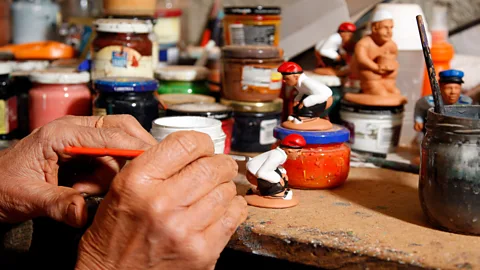 Miquel Benitez/Getty Images Catalans have a relaxed view of the caganer, seeing them as merely depicting a natural act as opposed to being uncouth (Credit: Miquel Benitez/Getty Images)