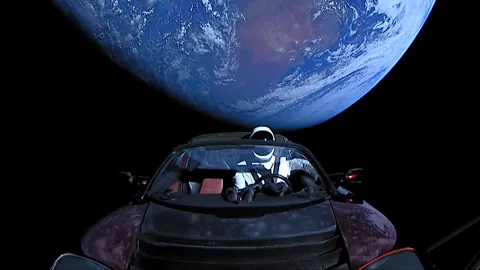 Getty Images In a handout photo provided by SpaceX, a Tesla roadster launched from a rocket with a dummy driver named Starman heads towards Mars (Credit: Getty Images)