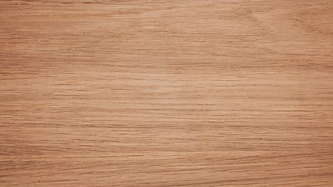 The texture of oak - a medium brown with darker lines going through it.