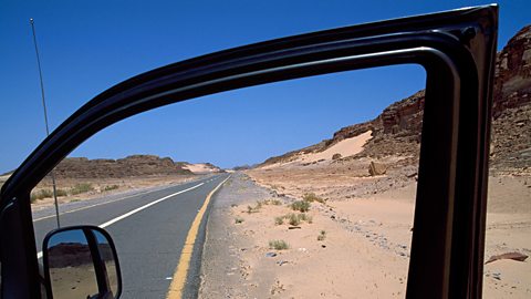 An open car door showing the hemmed edge of the interior of the door.