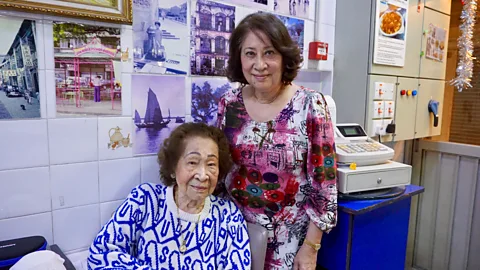 Matthew Keegan Often dubbed ‘the godmother of Macanese cuisine’, 103-year-old Aida de Jesus (left) opened the first Macanese restaurant in Macau (Credit: Matthew Keegan)