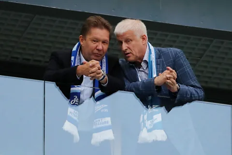 Getty Images Gazprom's CEO, Alexei Miller (left), is Russia's highest-paid executive (Credit: Getty Images)
