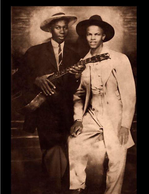A photograph of Robert Johnson with fellow blues musician Johnny Shines.
