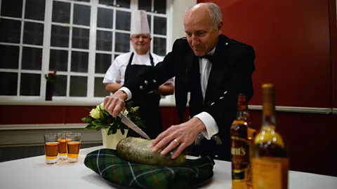 Jeff J Mitchell/Getty Images A tradition since 1801, the Burns Night dinner now ranges from informal gatherings of friends and family to large formal feasts (Credit: Jeff J Mitchell/Getty Images)