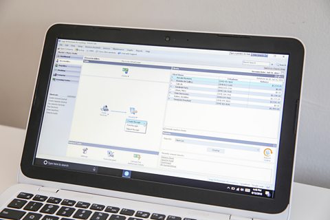 Sage50 software displayed on laptop