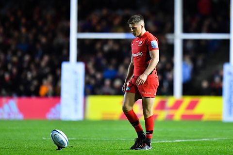 Rugby player Owen Farrell prepares to take a kick.