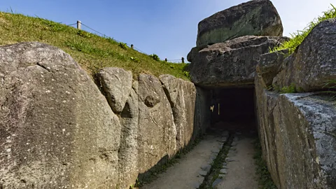 Getty Images Between the 3rd and 6th Centuries AD, large tombs known as Kofun began appearing as the social hierarchies in Japan changed (Credit: Getty Images)