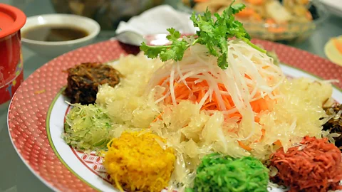 coleong/Getty Images The sign for each ingredient in yu sheng has a lucky double meaning in the Chinese language (Credit: coleong/Getty Images)