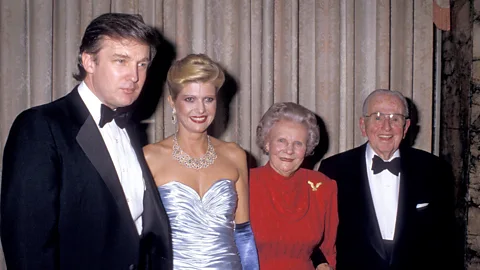 Getty Images Donald Trump and Ivana Trump pose with self-help author Norman Peale and his wife Ruth Stafford Peale at a party in 1988 (Credit: Getty Images)