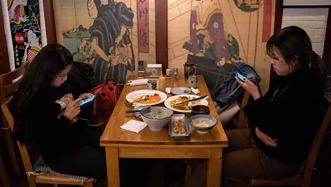 Getty ‘When people look at their devices during their meal, instead of talking to each other while they eat, they lose so much of the multi-sensuous aspects of food’ (Credit: Getty)