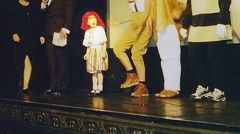 Megan on stage as a child